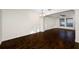 Open and bright living room with dark wood floors at 13122 Thoroughbred Loop, Largo, FL 33773