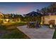 Evening view of backyard, patio, and pool area at 1726 Serpentine S Dr, St Petersburg, FL 33712