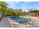 Relaxing pool area with lounge chairs and patio at 1726 Serpentine S Dr, St Petersburg, FL 33712