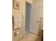 Clean bathroom with beige tile and towel rack at 1751 St Anthony Dr, Clearwater, FL 33759