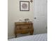 Bedroom with a wooden dresser and decor at 1751 St Anthony Dr, Clearwater, FL 33759