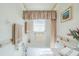 Bright bathroom featuring a bathtub and shower at 2043 Prestancia Ln, Sun City Center, FL 33573