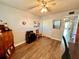 Spacious bedroom featuring wood-look floors and ample closet space at 2257 World Parkway W Blvd # 39, Clearwater, FL 33763