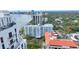 Expansive aerial perspective of bayfront condos showcasing city views, nearby buildings, and waterfront access at 2401 Bayshore Blvd # 410 & 510, Tampa, FL 33629