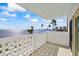 Outdoor balcony overlooking the water and cityscape with a patterned concrete railing at 2401 Bayshore Blvd # 410 & 510, Tampa, FL 33629