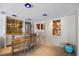 A stylish bar area with custom lighting, modern stools, and stainless steel appliances for entertaining guests at 2401 Bayshore Blvd # 410 & 510, Tampa, FL 33629