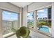 Scenic city and ocean view from a large window with light neutral colored trim and bright sunlight at 2401 Bayshore Blvd # 410 & 510, Tampa, FL 33629