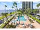 An aerial view highlighting the community pool and the lounge area surrounded by mature landscaping at 2401 Bayshore Blvd # 410 & 510, Tampa, FL 33629