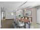 Dining room with spiral staircase, modern light fixtures, a large picture and dining table for six at 2401 Bayshore Blvd # 410 & 510, Tampa, FL 33629
