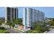 Condo complex featuring a pool area, landscaping and modern architectural design at 2401 Bayshore Blvd # 410 & 510, Tampa, FL 33629