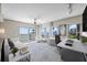 Bright, stylish living space with water views, a ceiling fan, a desk and light neutral colors at 2401 Bayshore Blvd # 410 & 510, Tampa, FL 33629