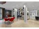 A well-lit lobby with contemporary decor including a piano, seating, fireplace, and modern artwork at 2401 Bayshore Blvd # 410 & 510, Tampa, FL 33629