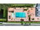 Aerial shot of a community pool with lounge chairs, landscaping, and a serene environment at 2401 Bayshore Blvd # 410 & 510, Tampa, FL 33629