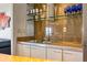 Wet bar featuring granite countertops and stainless steel sink at 2401 Bayshore Blvd # 410 & 510, Tampa, FL 33629