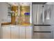 Modern wet bar with granite countertops, stainless steel sink, and glass shelving at 2401 Bayshore Blvd # 410 & 510, Tampa, FL 33629