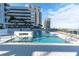 Relaxing rectangular pool with surrounding lounge chairs and building views at 301 1St S St # 2203, St Petersburg, FL 33701