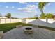 Spacious backyard with fire pit, grassy area, and a white vinyl fence at 4129 36Th N Ave, St Petersburg, FL 33713
