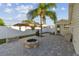 Backyard patio with fire pit and palm tree, adjacent to the house at 4129 36Th N Ave, St Petersburg, FL 33713