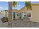 Backyard showing a patio, blue doors, and a tropical palm tree at 4129 36Th N Ave, St Petersburg, FL 33713