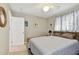 Comfortable bedroom with a queen-size bed and easy access to the bathroom at 4129 36Th N Ave, St Petersburg, FL 33713