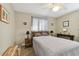 Comfortable bedroom with a ceiling fan, a bed, and matching side tables at 4129 36Th N Ave, St Petersburg, FL 33713