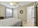 Bright bedroom with a queen-size bed and access to bathroom at 4129 36Th N Ave, St Petersburg, FL 33713