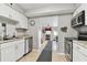 Bright kitchen featuring stainless steel appliances and white cabinetry at 4129 36Th N Ave, St Petersburg, FL 33713