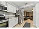 Modern kitchen with white cabinets, stainless steel appliances, and tile backsplash at 4129 36Th N Ave, St Petersburg, FL 33713