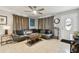 Comfortable living room with tile floors, a ceiling fan, and stylish furniture at 4129 36Th N Ave, St Petersburg, FL 33713