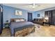 Bright primary bedroom with wood bed, a sofa, and tiled flooring at 4129 36Th N Ave, St Petersburg, FL 33713