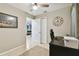 Well-lit office features a desk, chair, and view into the living area at 4129 36Th N Ave, St Petersburg, FL 33713