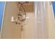 A simple shower showcases yellow tile, offering a clean and functional space at 4129 36Th N Ave, St Petersburg, FL 33713