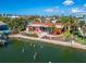 Waterfront home with private pool and dock, offering serene views at 425 Capri Blvd, Treasure Island, FL 33706