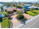 House with brick driveway and lush landscaping at 425 Capri Blvd, Treasure Island, FL 33706