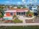 Aerial view of single-story home with pool and canal access at 425 Capri Blvd, Treasure Island, FL 33706
