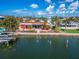Waterfront home showcasing a relaxing patio and canal views at 425 Capri Blvd, Treasure Island, FL 33706
