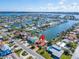 Aerial view of a house on the water in a residential neighborhood at 425 Capri Blvd, Treasure Island, FL 33706