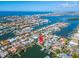 Aerial view of house on the water, near other homes and boats at 425 Capri Blvd, Treasure Island, FL 33706