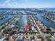 Aerial view showing home's location in a waterfront community with boats and waterways at 425 Capri Blvd, Treasure Island, FL 33706