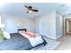 Bright bedroom with ceiling fan, large windows, and ample closet space at 4608 Glenside Cir, Tampa, FL 33624