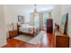Charming bedroom with a queen-size bed and hardwood floors at 511 Crowned Eagle Ct, Valrico, FL 33594