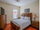 Comfortable bedroom with a king-size bed and wood furniture at 511 Crowned Eagle Ct, Valrico, FL 33594