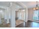Open and airy entryway with tile floors, columns and hardwood flooring at 511 Crowned Eagle Ct, Valrico, FL 33594