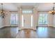 Bright and spacious entryway with hardwood floors and elegant light fixtures at 511 Crowned Eagle Ct, Valrico, FL 33594