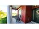 Relaxing front porch overlooking a tranquil pond, with rocking chairs at 511 Crowned Eagle Ct, Valrico, FL 33594