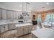 Spacious kitchen with an island, stainless steel appliances, and white cabinets at 511 Crowned Eagle Ct, Valrico, FL 33594
