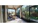 Spacious screened porch with comfortable seating and lush landscaping at 511 Crowned Eagle Ct, Valrico, FL 33594
