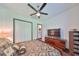 King bedroom with hardwood floors and ceiling fan at 6646 Park Strand Dr, Apollo Beach, FL 33572