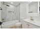 Elegant bathroom with marble tile and gold fixtures at 7435 Hideaway Trl, New Port Richey, FL 34655