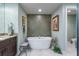 Spa-like bathroom with freestanding tub and decorative tile at 795 Collany Rd # 304, St Petersburg, FL 33715